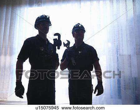 Workers holding wrenches View Large Photo Image Stock Photography - Workers holding wrenches. Fotosearch