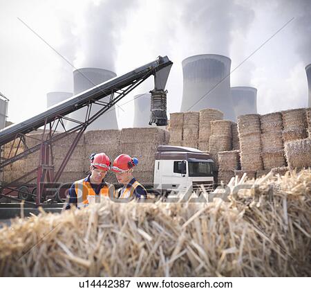 Workers in biomass fuel facility View Large Photo Image Stock Photo - Workers in biomass fuel facility. Fotosearch