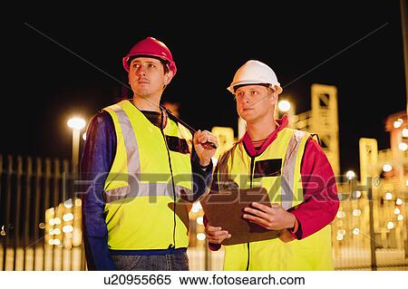 Workers standing together in shipyard View Large Photo Image Stock Photography - Workers standing together in shipyard. Fotosearch