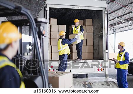 Workers unloading boxes from truck View Large Photo Image Stock Photography - Workers unloading boxes from truck. Fotosearch