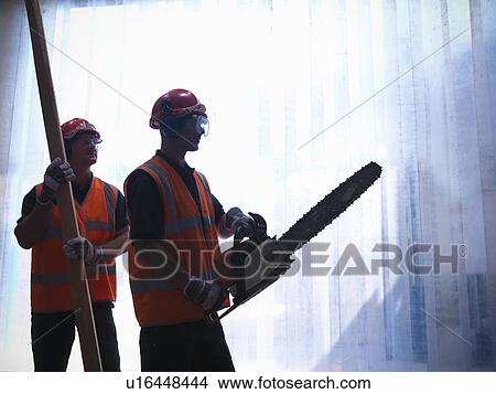 Workers with chainsaw and wooden plank View Large Photo Image Picture - Workers with chainsaw and wooden plank. Fotosearch