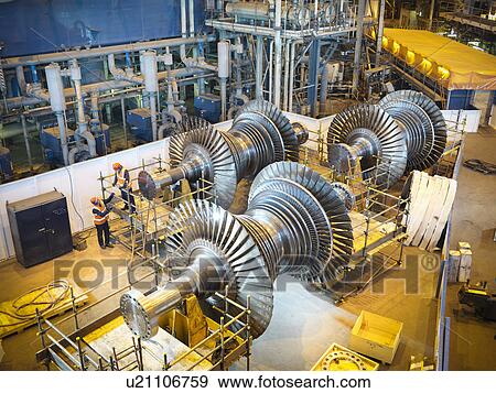 Workers with turbines in power station View Large Photo Image Stock Photo - Workers with turbines in power station. Fotosearch