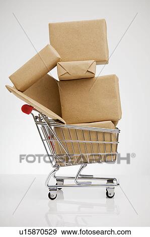 Wrapped packages in shopping cart View Large Photo Image Stock Photo - Wrapped packages in shopping cart. Fotosearch
