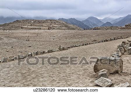 Caral ancient ruins: temple mounds with mountains beyond, stormy sky, Supe Valley, Peru View Large Photo Image Stock Image - Caral ancient ruins: temple mounds with mountains beyond, stormy sky, Supe Valley, Peru. Fotosearch