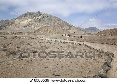 Caral ancient ruins: temple mounds with mountains beyond, pale blue sky, Supe Valley, Peru View Large Photo Image Stock Photo - Caral ancient ruins: temple mounds with mountains beyond, pale blue sky, Supe Valley, Peru. Fotosearch