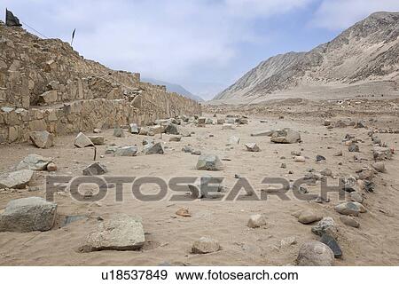 Caral ancient ruins: temple mounds with mountains beyond, pale blue sky, Supe Valley, Peru View Large Photo Image Stock Photo - Caral ancient ruins: temple mounds with mountains beyond, pale blue sky, Supe Valley, Peru. Fotosearch