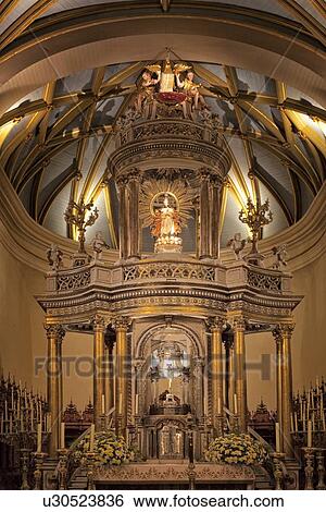 Stock Photograph - Catedral of Lima: detail of gilded altar seen from front, with graceful gilded ribbed arched ceiling, Spanish Baroque, Lima, Peru. Fotosearch