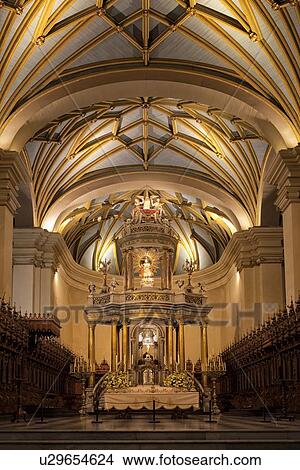 Picture - Catedral of Lima: gilded altar seen from front, with graceful gilded ribbed arched ceiling, wooden roccoco choir stalls Spanish Baroque, Lima, Peru. Fotosearch