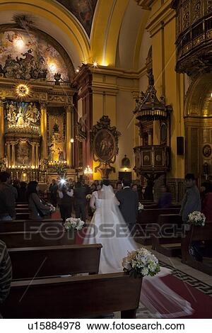 Stock Photo - Chapel of the Catedral with wedding in progress, ornate gilded decor of Spanish Baroque era, Lima, Peru. Fotosearch
