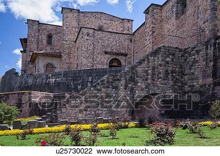 Stock Image - Cuzco: Qorikancha, San Domingo church built on Inca temple, with Inca stonework visible in foreground, Spanish colonial era Cuzco, Sacred Valley, Peru. Fotosearch