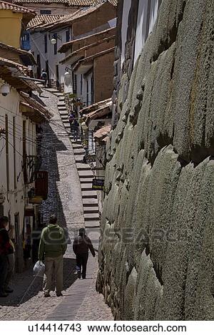 Cuzco: street scene on steep road to San Blas, cobbled street with steps, houses of stone, and white stucco, massive Inca stone wall in foreground, Cuzco, Sacred Valley, Peru View Large Photo Image Stock Image - Cuzco: street scene on steep road to San Blas, cobbled street with steps, houses of stone, and white stucco, massive Inca stone wall in foreground, Cuzco, Sacred Valley, Peru. Fotosearch