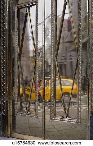 Doorway detail: brass double doors with reflections of yellow taxis, Lima, Peru View Large Photo Image Stock Image - Doorway detail: brass double doors with reflections of yellow taxis, Lima, Peru. Fotosearch
