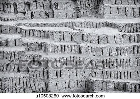 Stock Image - Huaca Pucllana: monochrome detail of adobe mud brick walls dating back to Lima culture of 400AD, Lima, Peru. Fotosearch