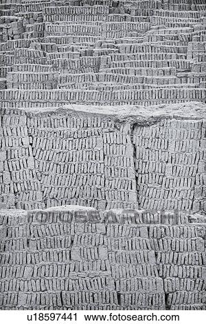 Stock Image - Huaca Pucllana: monochrome detail of adobe mud brick walls dating back to Lima culture of 400AD, Lima, Peru. Fotosearch