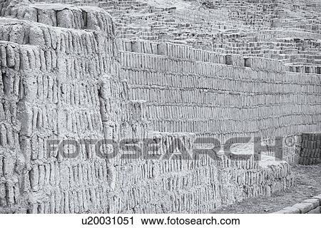 Stock Image - Huaca Pucllana: monochrome detail of adobe mud brick walls dating back to Lima culture of 400AD, Lima, Peru. Fotosearch