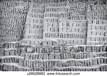 Stock Image - Huaca Pucllana: monochrome detail of adobe mud brick walls dating back to Lima culture of 400AD, Lima, Peru. Fotosearch