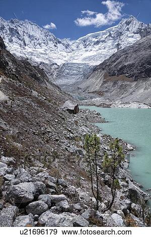 Llaca valley: glacier and moraine, with river and snow-capped mountains beyond, blue sky, Cordilleras, Peru View Large Photo Image Stock Photo - Llaca valley: glacier and moraine, with river and snow-capped mountains beyond, blue sky, Cordilleras, Peru. Fotosearch