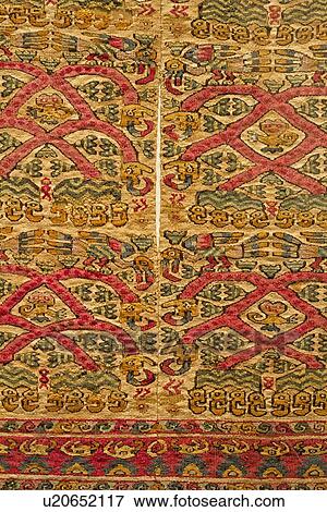 Stock Photo - Museo Larco: closeup of intricate Wari woven carpet: red, yellow, and green, Lima, Peru. Fotosearch