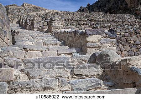Stock Image - Ollantaytambo ruins: detail view of stone stairway- agricultural terracing of Inca citadel, Sacred Valley, Cuzco, Peru. Fotosearch