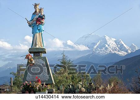 Statue of Madonna and child with snow-covered Huascaran mountain behind, Cordilleras, Peru View Large Photo Image Picture - Statue of Madonna and child with snow-covered Huascaran mountain behind, Cordilleras, Peru. Fotosearch