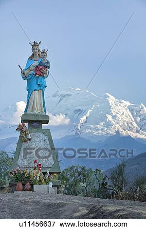 Statue of Madonna and child with snow-covered Huascaran mountain behind, Cordilleras, Peru View Large Photo Image Stock Photo - Statue of Madonna and child with snow-covered Huascaran mountain behind, Cordilleras, Peru. Fotosearch