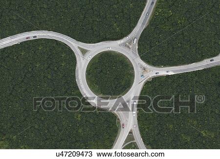 Stock Image - Aerial view of rural roundabout. Fotosearch