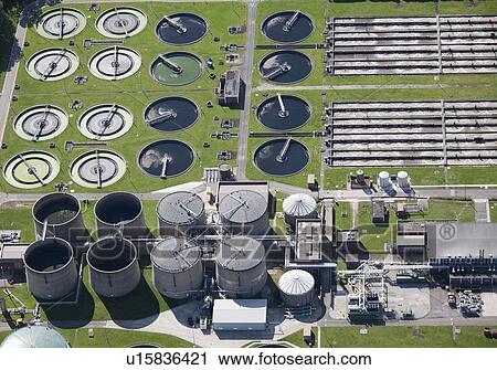 Stock Image - Aerial view of sewage treatment plant. Fotosearch