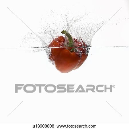 Bell pepper splashing in water View Large Photo Image Stock Photo - Bell pepper splashing in water. Fotosearch