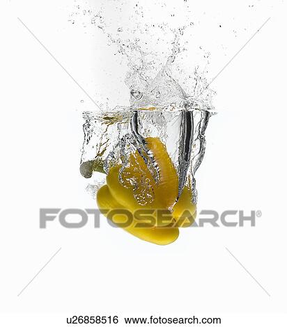 Stock Photograph - Bell pepper splashing in water. Fotosearch