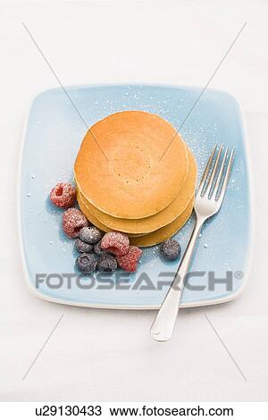 Berries and sugar on stack of pancakes View Large Photo Image Stock Image - Berries and sugar on stack of pancakes. Fotosearch