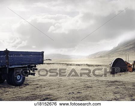 Blue truck and digger in dry field View Large Photo Image Stock Photograph - Blue truck and digger in dry field. Fotosearch