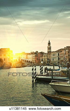 Stock Photography - Boats docked on urban pier. Fotosearch