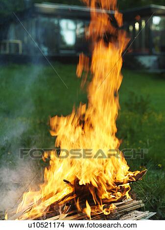 Bonfire burning in backyard View Large Photo Image Picture - Bonfire burning in backyard. Fotosearch