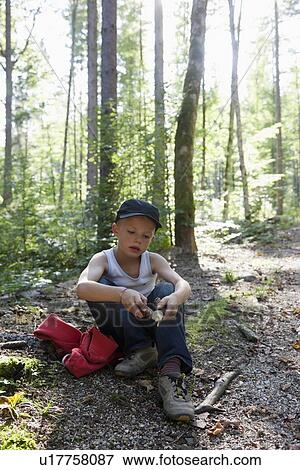 Boy playing in forest View Large Photo Image Stock Photo - Boy playing in forest. Fotosearch