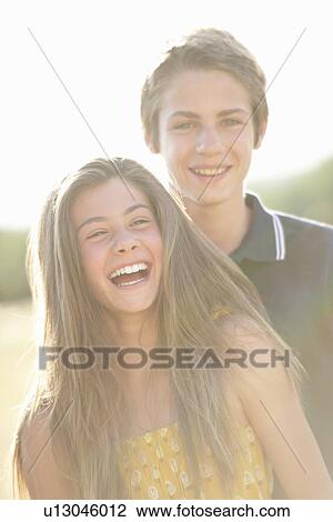 Brother and sister smiling together View Large Photo Image Stock Image - Brother and sister smiling together. Fotosearch