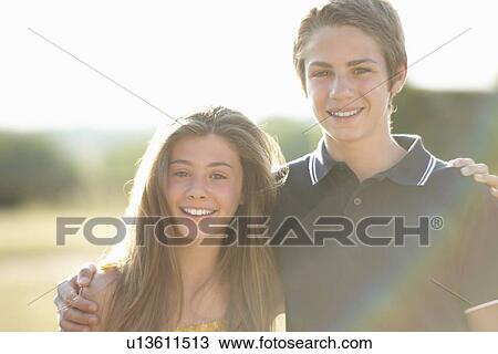 Brother and sister smiling together View Large Photo Image Stock Image - Brother and sister smiling together. Fotosearch