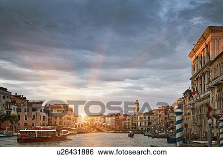 Buildings and ferryboat on urban canal View Large Photo Image Stock Photograph - Buildings and ferryboat on urban canal. Fotosearch