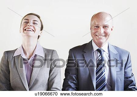 Business people laughing together View Large Photo Image Stock Image - Business people laughing together. Fotosearch