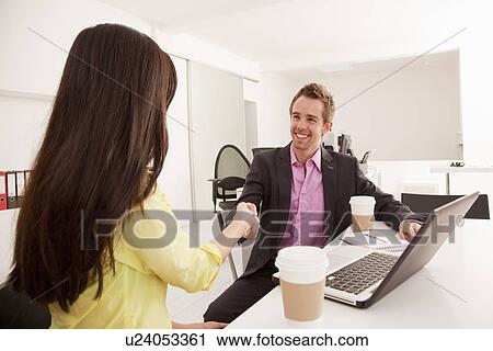 Business people shaking hands in office View Large Photo Image Stock Image - Business people shaking hands in office. Fotosearch