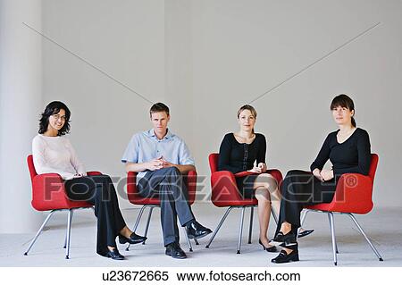 Business people sitting in office chairs View Large Photo Image Stock Photography - Business people sitting in office chairs. Fotosearch