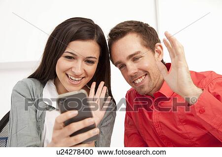 Business people using cell phone View Large Photo Image Stock Image - Business people using cell phone. Fotosearch