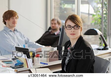 Business people working in office View Large Photo Image Picture - Business people working in office. Fotosearch