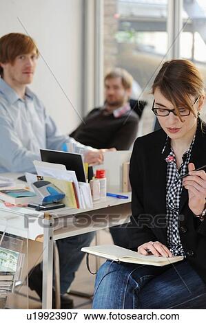 Business people working in office View Large Photo Image Stock Photo - Business people working in office. Fotosearch