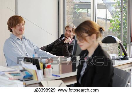 Business people working in office View Large Photo Image Stock Photo - Business people working in office. Fotosearch