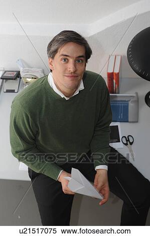Businessman holding paper airplane View Large Photo Image Stock Photography - Businessman holding paper airplane. Fotosearch