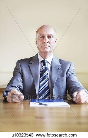 Stock Image - Businessman sitting in cafe. Fotosearch
