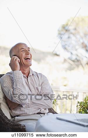 Businessman talking on cell phone View Large Photo Image Stock Photography - Businessman talking on cell phone. Fotosearch