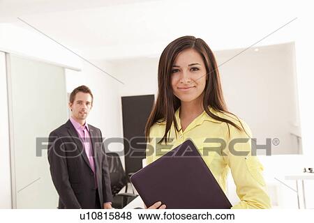 Businesswoman carrying tablet computer View Large Photo Image Stock Photo - Businesswoman carrying tablet computer. Fotosearch