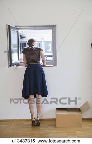 Businesswoman looking out window View Large Photo Image Stock Photography - Businesswoman looking out window. Fotosearch