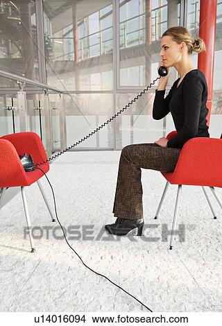 Businesswoman talking on phone View Large Photo Image Picture - Businesswoman talking on phone. Fotosearch